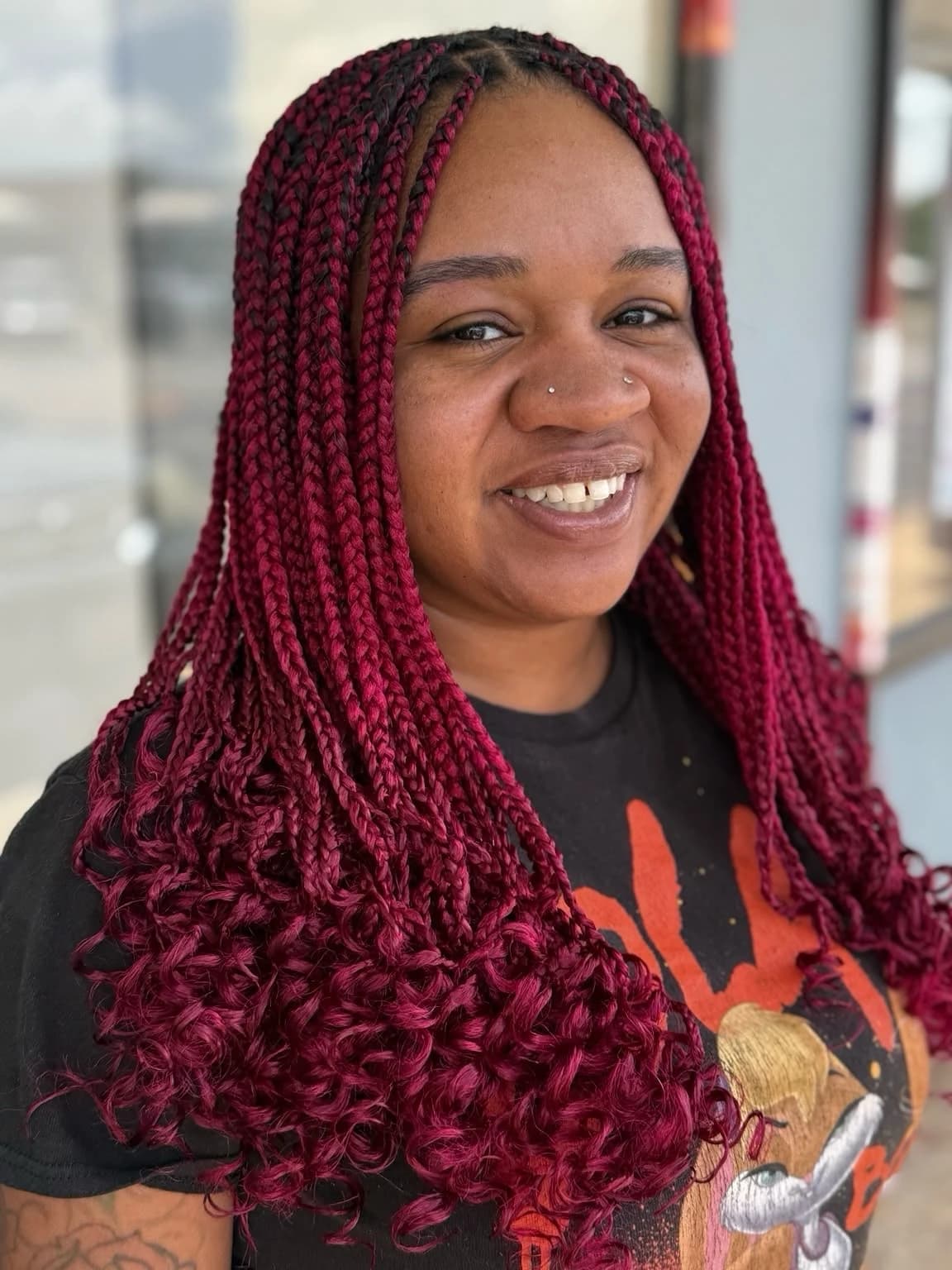 Burgundy braids with curled ends