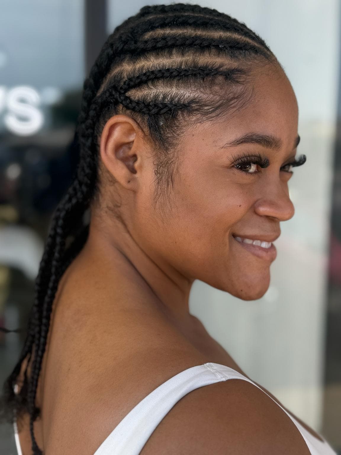 medium black neat feed in cornrows side view