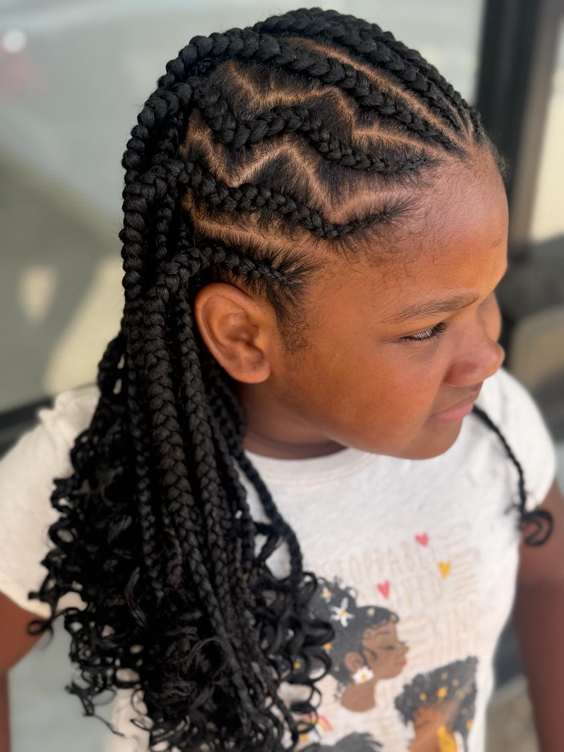 Black Medium Kids Stitch Braids with Curly Ends right side View — Pejah Braiding client work