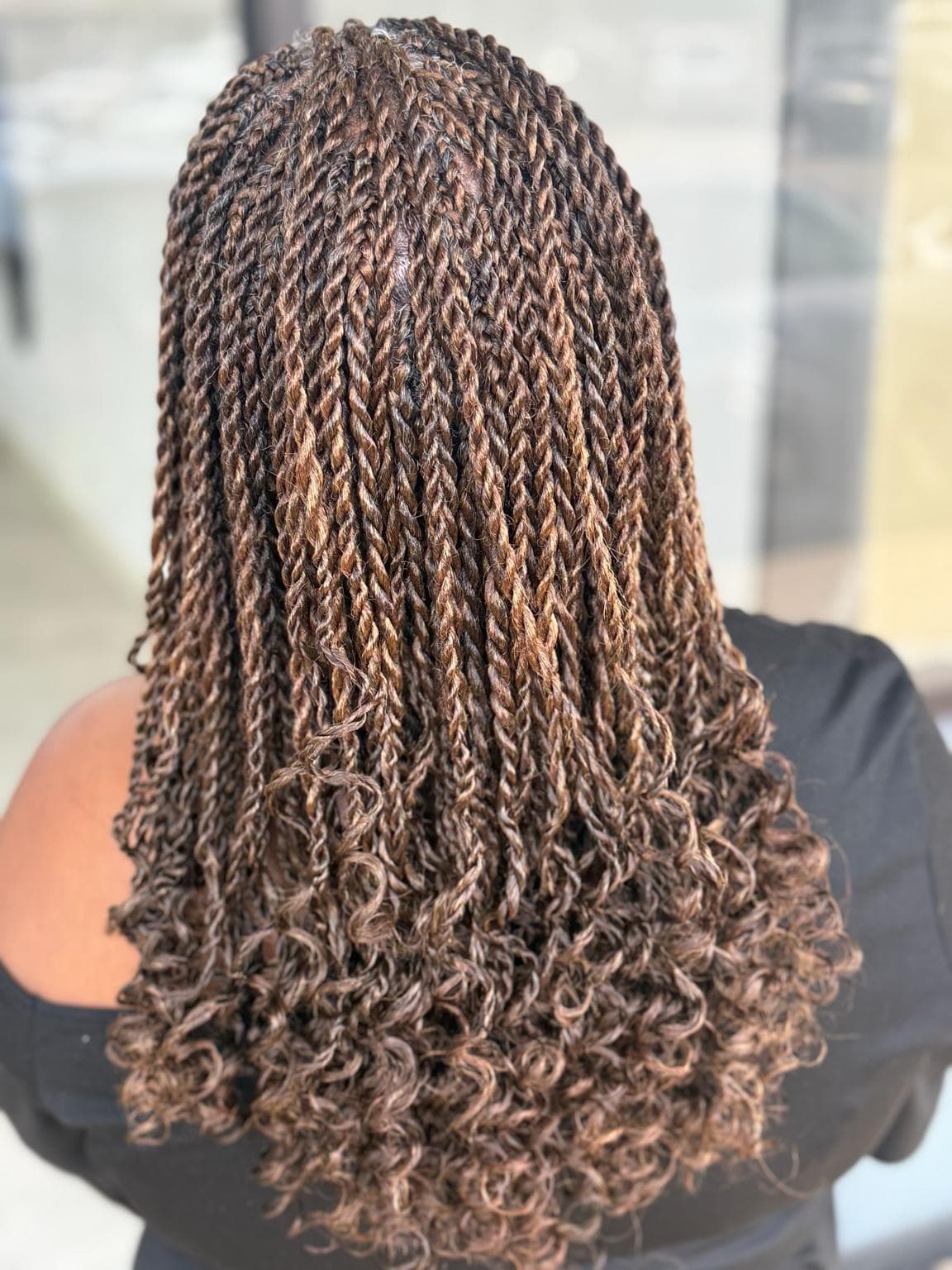 Medium Senegalese Twists with soft curly ends back view outdoor — Pejah Braiding client work