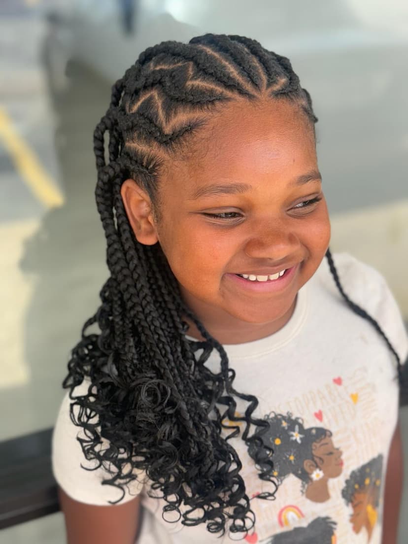 Boho knotless braids with curly ends at Pejah Braiding